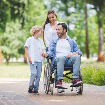 depositphotos_276266402-stock-photo-beautiful-mother-rolling-wheelchair-disabled